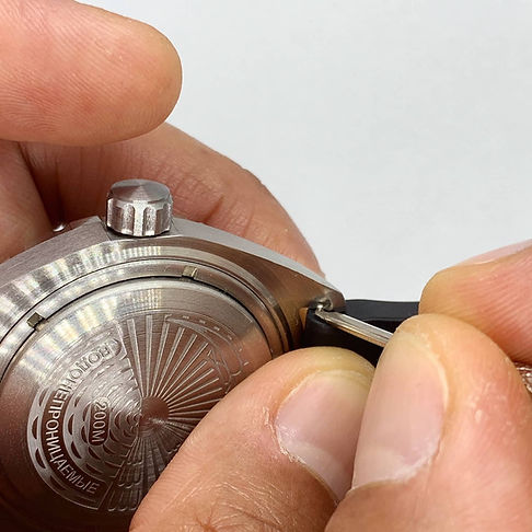 Using spring bar tool to install new watch strap