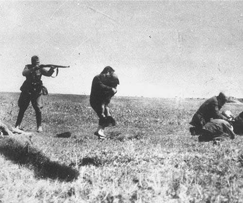 A Nazi soldier shooting from a very close range to kill a Jewish mother, who was desperate to save her child by embracing the child